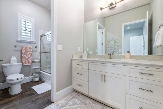 2706 Trenton Ave, Clovis, CA 93619 - bathroom with vanity, wood finished floors, and enclosed tub / shower combo