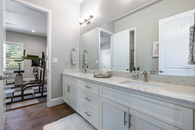 2706 Trenton Ave, Clovis, CA 93619 - bathroom featuring double vanity and wood finished floors