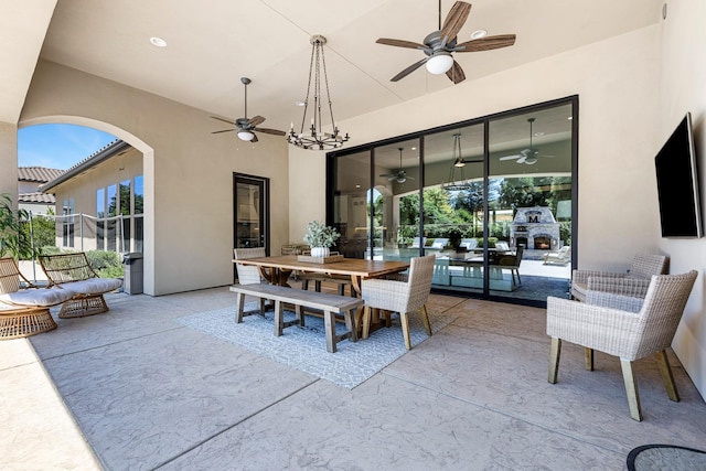 2706 Trenton Ave, Clovis, CA 93619 - view of patio featuring an outdoor stone fireplace, ceiling fan, and outdoor dining space