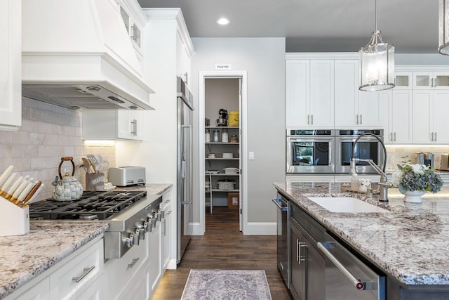 2706 Trenton Ave, Clovis, CA 93619 - kitchen with appliances with stainless steel finishes, premium range hood, white cabinets, glass insert cabinets, and recessed lighting