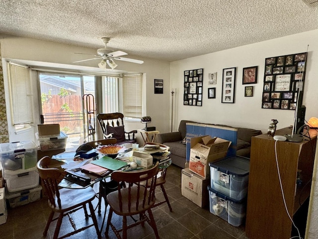 7637 Nixos Way, Sacramento, CA 95823 - dining space with a ceiling fan, a textured ceiling, and dark tile patterned flooring