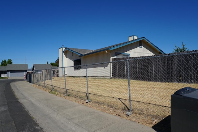 7637 Nixos Way, Sacramento, CA 95823 - view of side of property with a detached garage