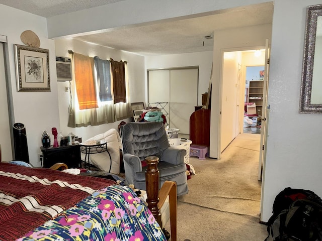 7637 Nixos Way, Sacramento, CA 95823 - bedroom with carpet, a closet, a textured ceiling, and a wall unit AC