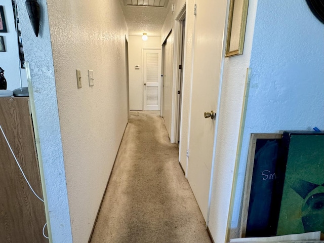 7637 Nixos Way, Sacramento, CA 95823 - corridor featuring a textured wall and attic access