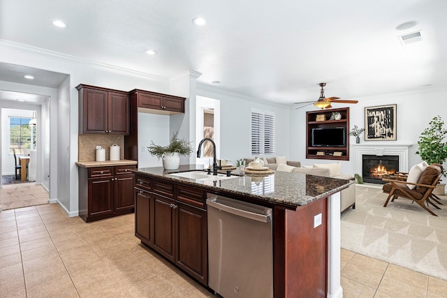 4160 N Creekbend, Clovis, CA 93619 - kitchen with dishwasher, light tile patterned flooring, a glass covered fireplace, ceiling fan, and dark stone counters