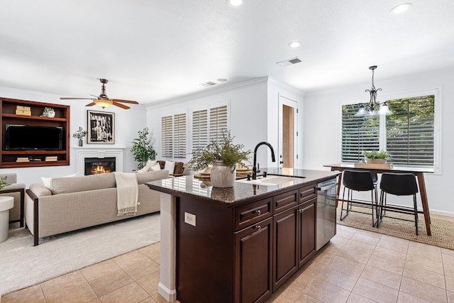 4160 N Creekbend, Clovis, CA 93619 - kitchen with dishwasher, light tile patterned flooring, ceiling fan, dark brown cabinets, and recessed lighting