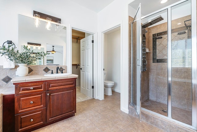 4160 N Creekbend, Clovis, CA 93619 - full bathroom with ceiling fan, a shower stall, vanity, and tasteful backsplash