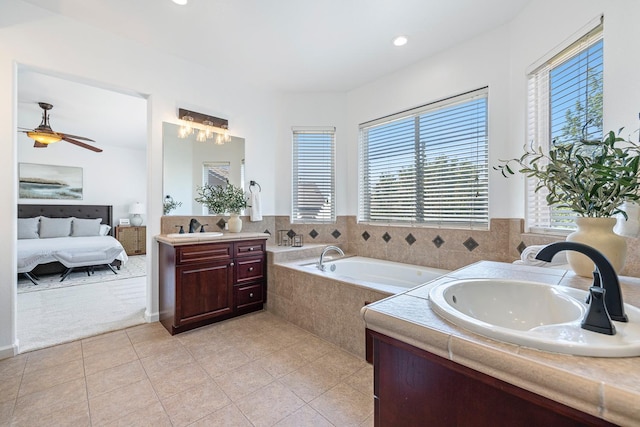 4160 N Creekbend, Clovis, CA 93619 - ensuite bathroom with two vanities, a bath, tile patterned flooring, a ceiling fan, and recessed lighting