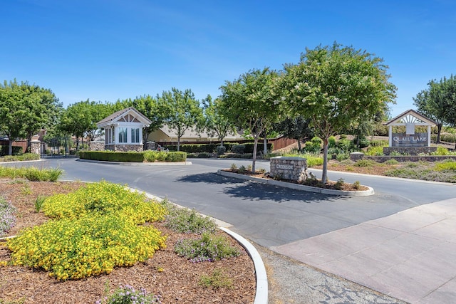 4160 N Creekbend, Clovis, CA 93619 - view of asphalt street featuring curbs and a gated entry