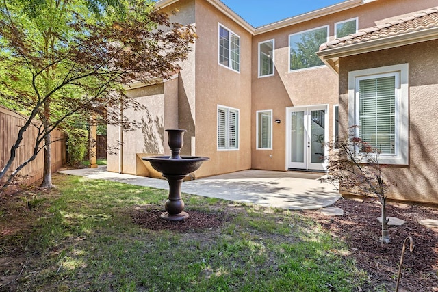 4160 N Creekbend, Clovis, CA 93619 - back of property with a fenced backyard, stucco siding, a patio, and french doors