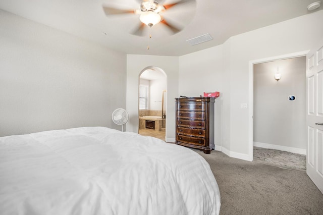 1728 E Green Sage Ave, Fresno, CA 93730 - bedroom with arched walkways, carpet flooring, ceiling fan, and ensuite bathroom