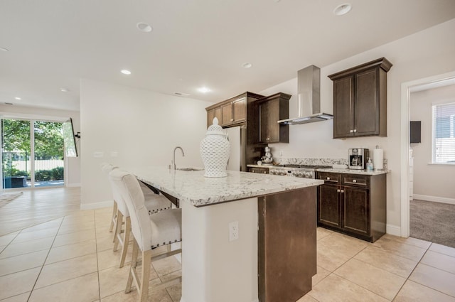1728 E Green Sage Ave, Fresno, CA 93730 - kitchen featuring wall chimney range hood, light tile patterned floors, plenty of natural light, and recessed lighting