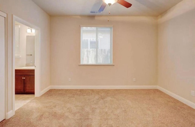 1728 E Green Sage Ave, Fresno, CA 93730 - empty room with light colored carpet and ceiling fan