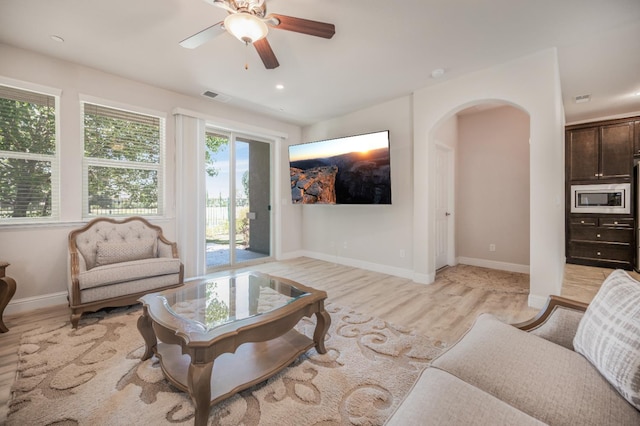 1728 E Green Sage Ave, Fresno, CA 93730 - living room featuring arched walkways, ceiling fan, light wood-type flooring, and recessed lighting
