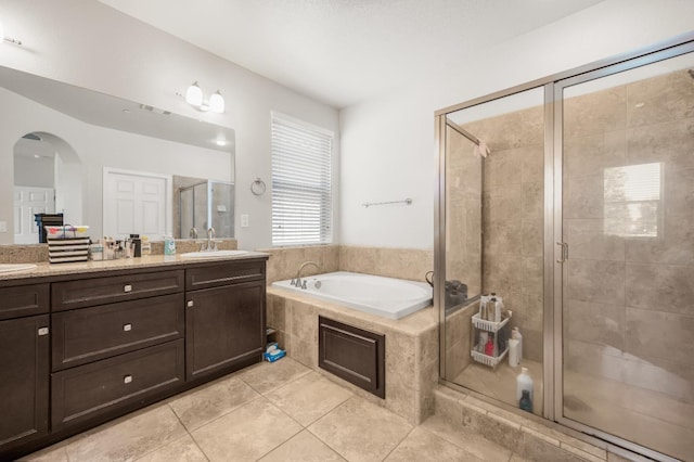 1728 E Green Sage Ave, Fresno, CA 93730 - bathroom with tile patterned flooring, double vanity, a bath, and a stall shower
