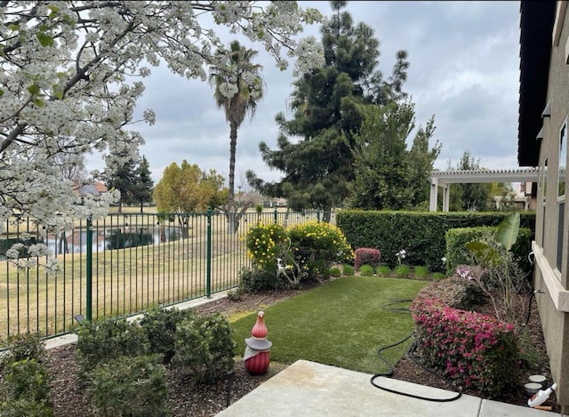 1728 E Green Sage Ave, Fresno, CA 93730 - fenced backyard featuring a pergola, a patio area, and a water view