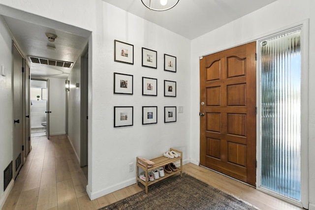 4678 N Thorne Ave, Fresno, CA 93704 - foyer entrance featuring light wood finished floors