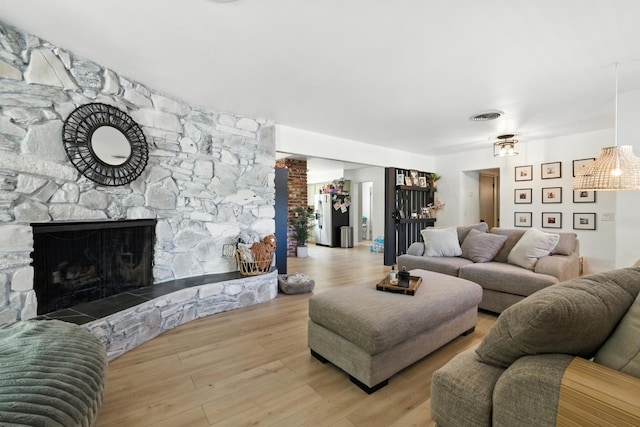 4678 N Thorne Ave, Fresno, CA 93704 - living area with a fireplace and light wood finished floors