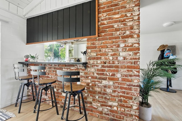 4678 N Thorne Ave, Fresno, CA 93704 - bar with wood finished floors and a sink