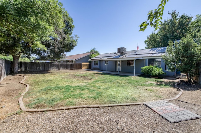 6283 N Gilroy Ave, Fresno, CA 93722 - fenced backyard featuring a patio
