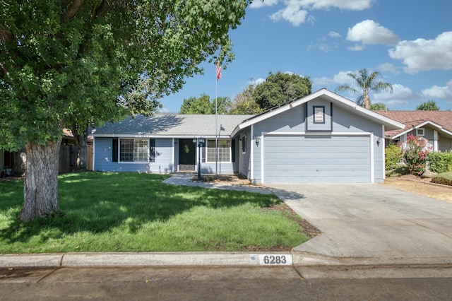 6283 N Gilroy Ave, Fresno, CA 93722 - ranch-style home with a garage, driveway, and a front yard
