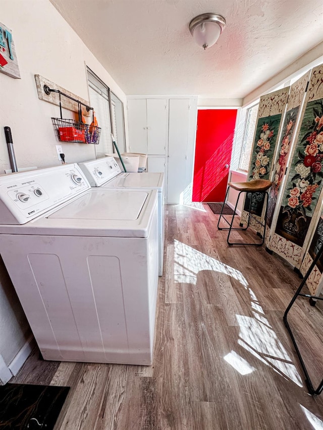 37969 Rd 422, Oakhurst, CA 93644 - washroom with wood finished floors, independent washer and dryer, and a textured ceiling