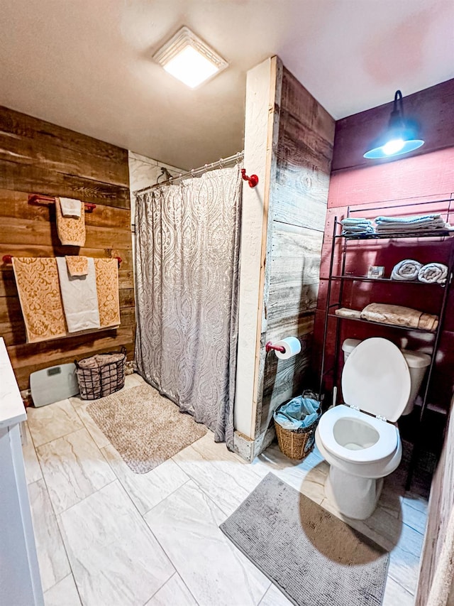 37969 Rd 422, Oakhurst, CA 93644 - bathroom with wooden walls, a shower with curtain, marble look tile flooring, and vanity