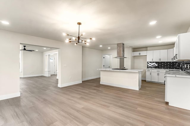 2643 B St, Selma, CA 93662 - kitchen with range hood, open floor plan, recessed lighting, a center island, and a chandelier