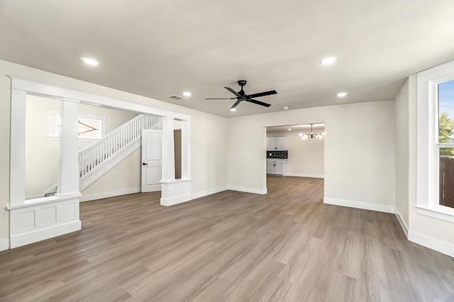 2643 B St, Selma, CA 93662 - unfurnished living room with wood finished floors, recessed lighting, stairs, and a ceiling fan
