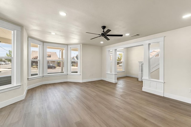 2643 B St, Selma, CA 93662 - unfurnished living room featuring healthy amount of natural light, wood finished floors, recessed lighting, and ceiling fan