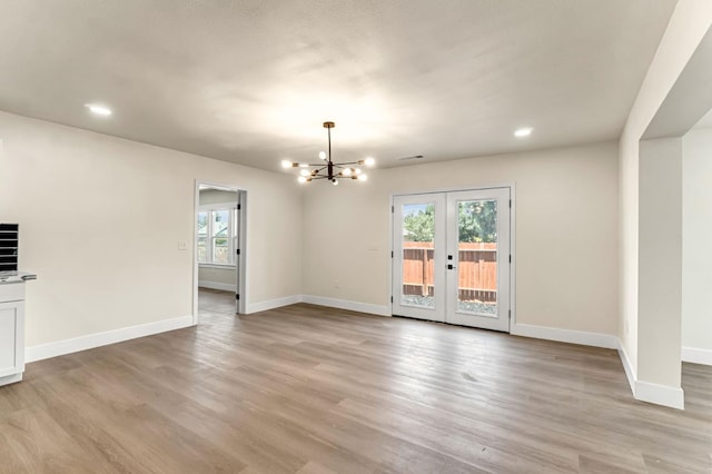 2643 B St, Selma, CA 93662 - unfurnished living room featuring a chandelier, light wood finished floors, recessed lighting, and french doors