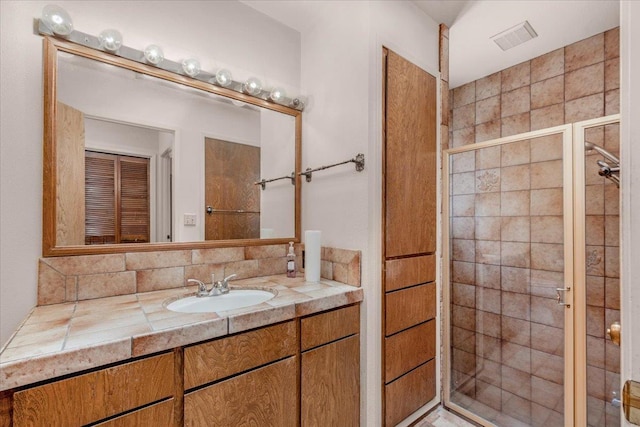 835 E Ashcroft Ave, Fresno, CA 93704 - bathroom featuring vanity, a shower stall, and backsplash