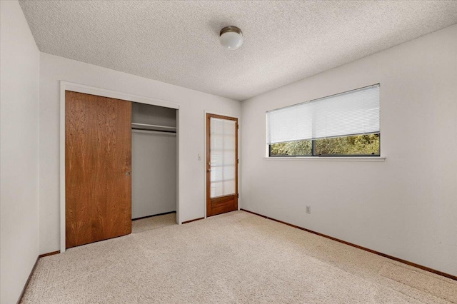 835 E Ashcroft Ave, Fresno, CA 93704 - unfurnished bedroom with a closet, carpet floors, and a textured ceiling