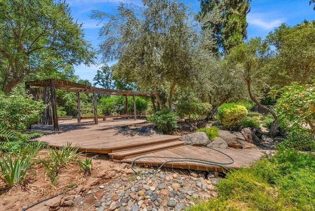 835 E Ashcroft Ave, Fresno, CA 93704 - wooden deck featuring a pergola