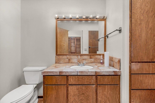 835 E Ashcroft Ave, Fresno, CA 93704 - bathroom featuring vanity and tasteful backsplash