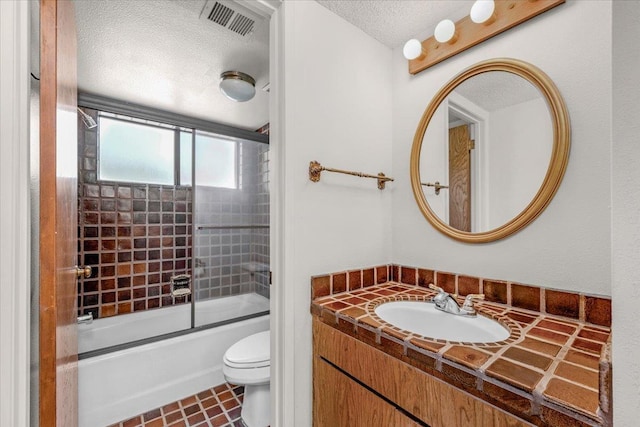 835 E Ashcroft Ave, Fresno, CA 93704 - full bath with a textured ceiling, bath / shower combo with glass door, and vanity