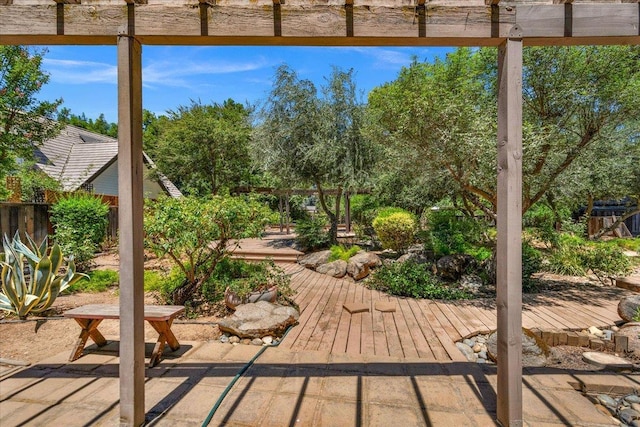 835 E Ashcroft Ave, Fresno, CA 93704 - wooden terrace featuring a patio area, view of wooded area, and a pergola