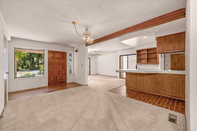 835 E Ashcroft Ave, Fresno, CA 93704 - carpeted entryway featuring a ceiling fan, a textured ceiling, and a chandelier