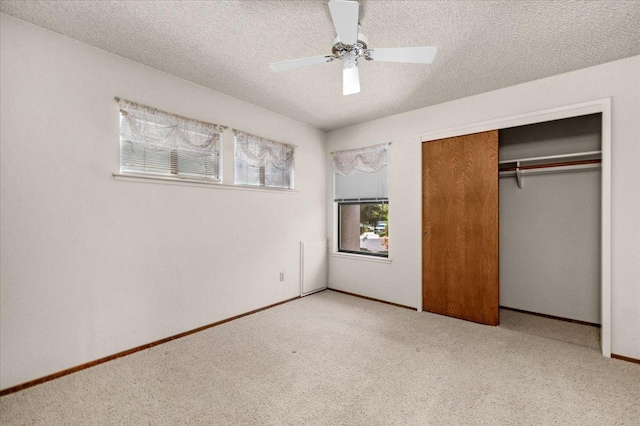 835 E Ashcroft Ave, Fresno, CA 93704 - unfurnished bedroom featuring carpet floors, a closet, ceiling fan, and a textured ceiling