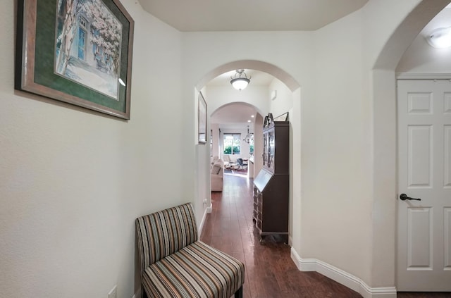 11319 N Via Napoli Dr, Fresno, CA 93730 - corridor with arched walkways and dark wood finished floors