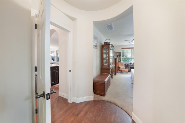 11319 N Via Napoli Dr, Fresno, CA 93730 - hallway featuring arched walkways and wood finished floors