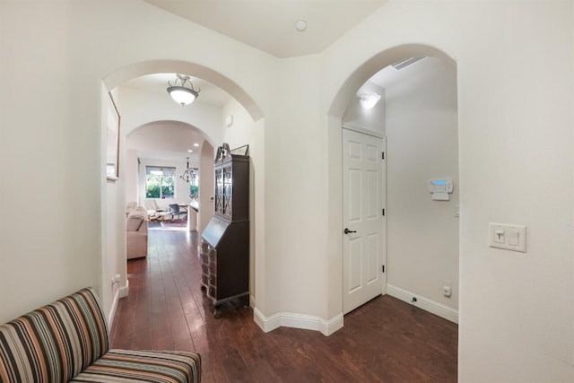 11319 N Via Napoli Dr, Fresno, CA 93730 - corridor with hardwood / wood-style flooring and arched walkways