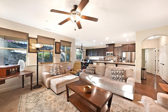 11319 N Via Napoli Dr, Fresno, CA 93730 - living room featuring ceiling fan, recessed lighting, and arched walkways