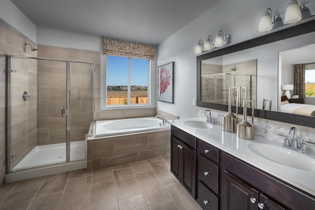 4553 Griffith Ave, Clovis, CA 93619 - bathroom featuring a stall shower, a bath, double vanity, and tile patterned flooring