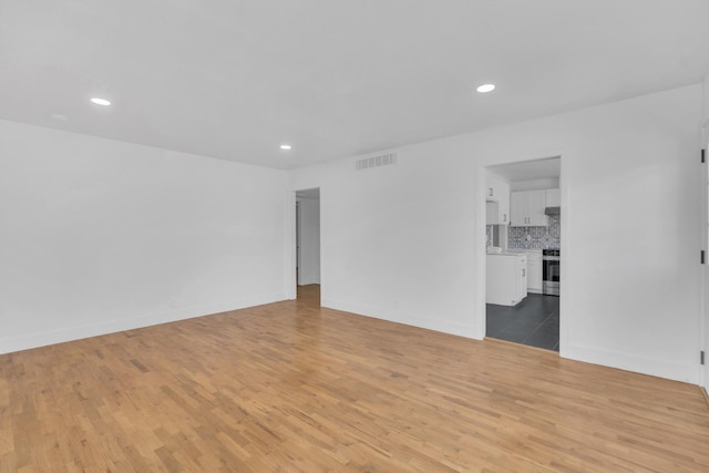 4596 E Huntington Ave, Fresno, CA 93702 - empty room featuring light wood-type flooring and recessed lighting