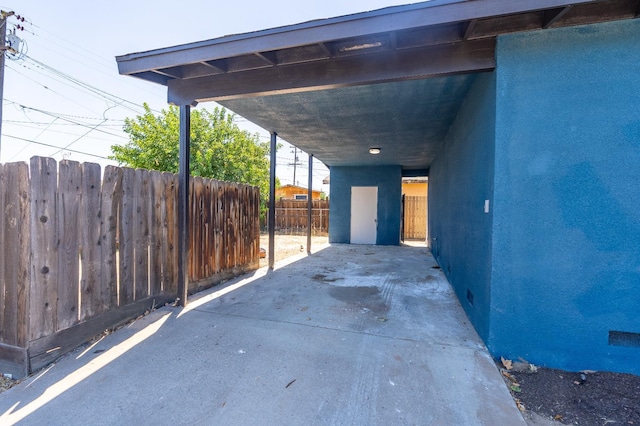 4596 E Huntington Ave, Fresno, CA 93702 - view of patio featuring a carport and concrete driveway