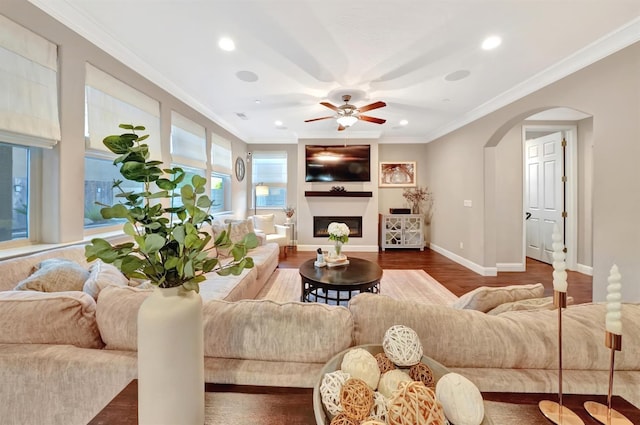 11617 N Bella Verde Ave, Fresno, CA 93730 - living area with crown molding, recessed lighting, wood finished floors, ceiling fan, and arched walkways