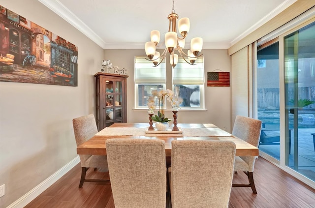 11617 N Bella Verde Ave, Fresno, CA 93730 - dining room with a chandelier, dark wood-style flooring, and crown molding