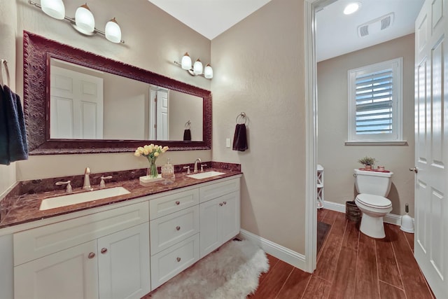 11617 N Bella Verde Ave, Fresno, CA 93730 - bathroom with double vanity and wood finished floors