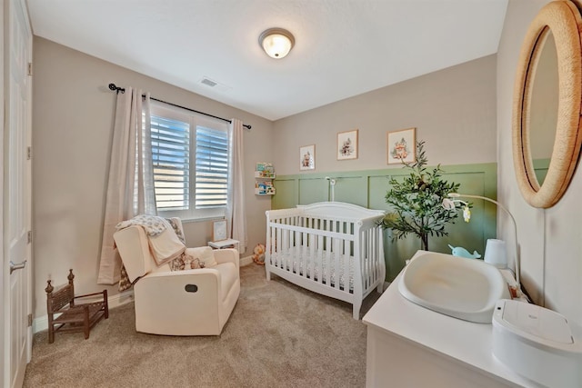 11617 N Bella Verde Ave, Fresno, CA 93730 - carpeted bedroom featuring a crib and baseboards